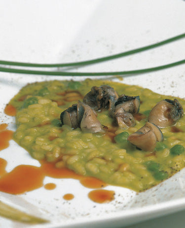 foto ricetta Riso con piselli, basilico e lumache di mare (garusoli) 